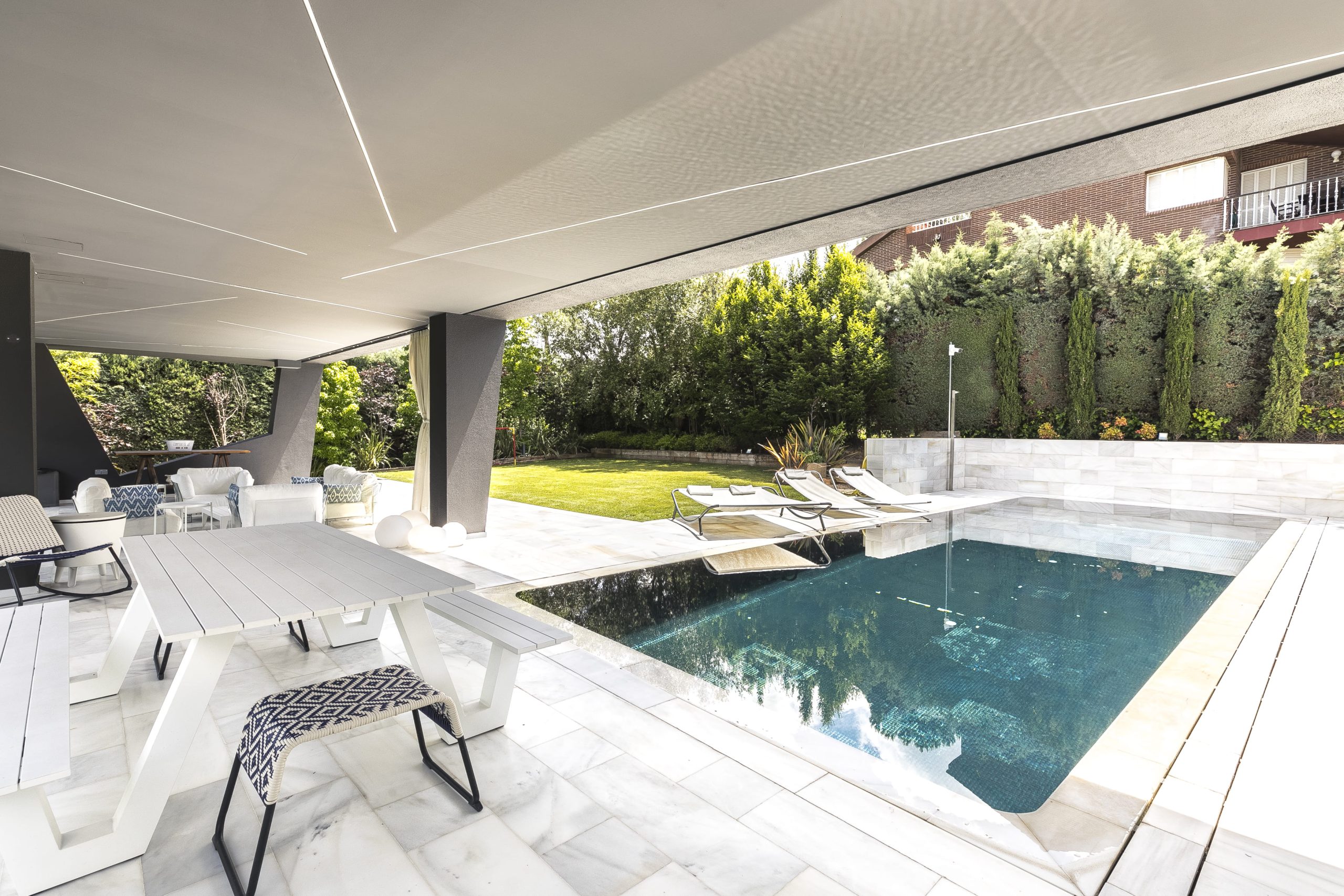 Stunning images of a contemporary chalet featuring 6 bedrooms, an infinity pool, and a beautifully landscaped garden, designed for luxury living and energy efficiency.